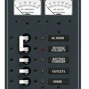 Powerboat 120V AC distribution panel with switches for AC main, reverse polarity, battery charger, outlets, and spare.