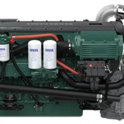 High-performance marine diesel engine with dual oil filters, green casing, and advanced components for powerboating.