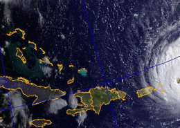 Satellite view of a hurricane near Florida and the Caribbean, capturing path crucial for powerboat navigation safety.