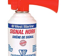 Red and white marine signal horn for safety on powerboats, essential for navigation and emergency situations.