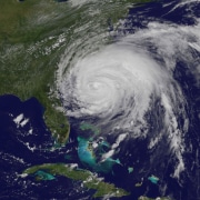 Satellite image of a powerful hurricane storm swirling over the Atlantic Ocean, near the southeastern coast of the USA.