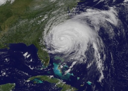 Satellite image of a powerful hurricane storm swirling over the Atlantic Ocean, near the southeastern coast of the USA.