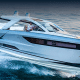 Sleek powerboat cruising at high speed on open water, showcasing modern design and performance.