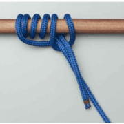 Blue rope tied with figure-eight knot on wooden rod, essential powerboating skill for secure docking and safety.