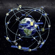 Satellites orbiting Earth in space, representing global communication and navigation technology.