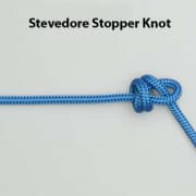 Blue rope tied with a Stevedore Stopper Knot, a reliable knot for securing lines in powerboating and sailing.