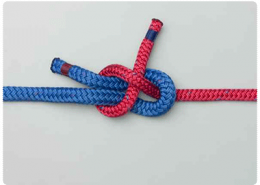 Bowline knot tying red and blue ropes for secure powerboating. Essential nautical knot for reliable boating safety.