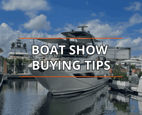 Luxury yacht at a boat show with Boat Show Buying Tips text overlay, under blue skies.