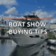 Luxury yacht at a boat show with Boat Show Buying Tips text overlay, under blue skies.