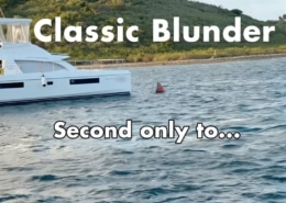 A catamaran near a coastal shoreline with Classic Blunder text overlay on a scenic boating day.