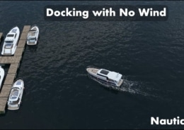 Powerboat docking smoothly in calm marina waters, demonstrating expert boating techniques.